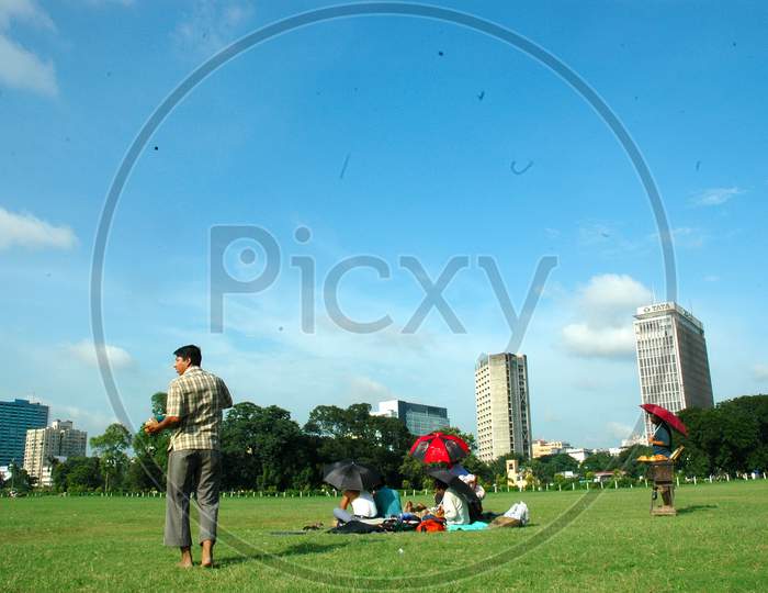 People Sitting in Maidan Or Lawn Garden In Kolkata