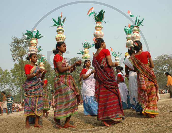 Indian Tribal People Performing Traditional Folk Dance  With Pots On Their Heads During Festivals in Murshidabad, West Bengal