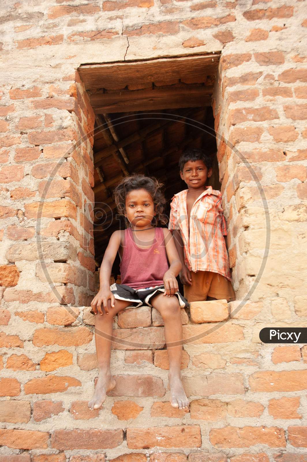 Children At Indian Rural Village Houses