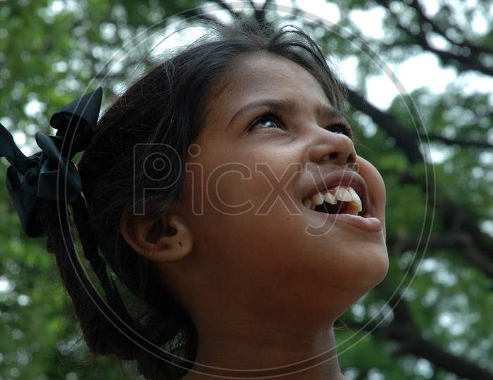 Indian Young Girl Child With a Smile Expression on Streets Of  Kolkata