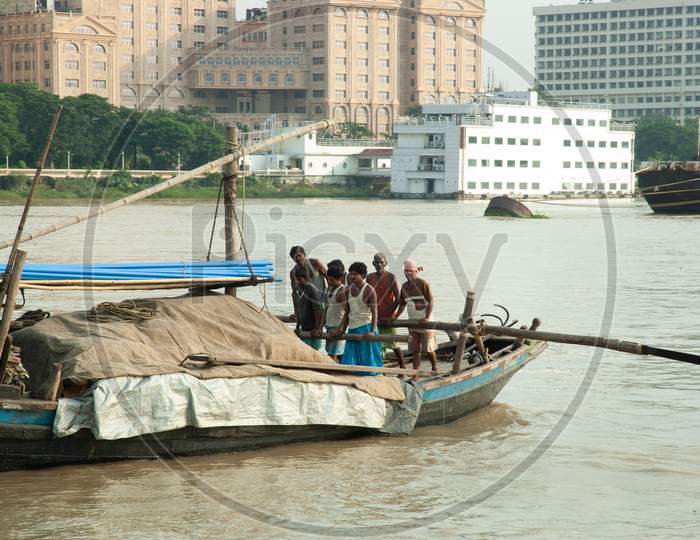 Local fishermen sailing the boat