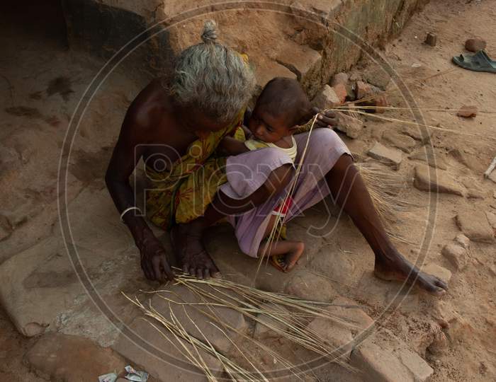 Grandmother With Her Grandchild At an Rural Indian Village