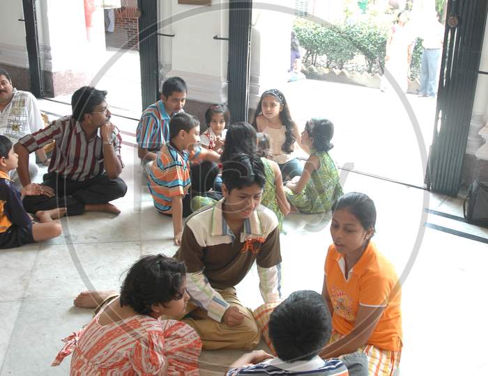 Indian children playing group games inside the temple