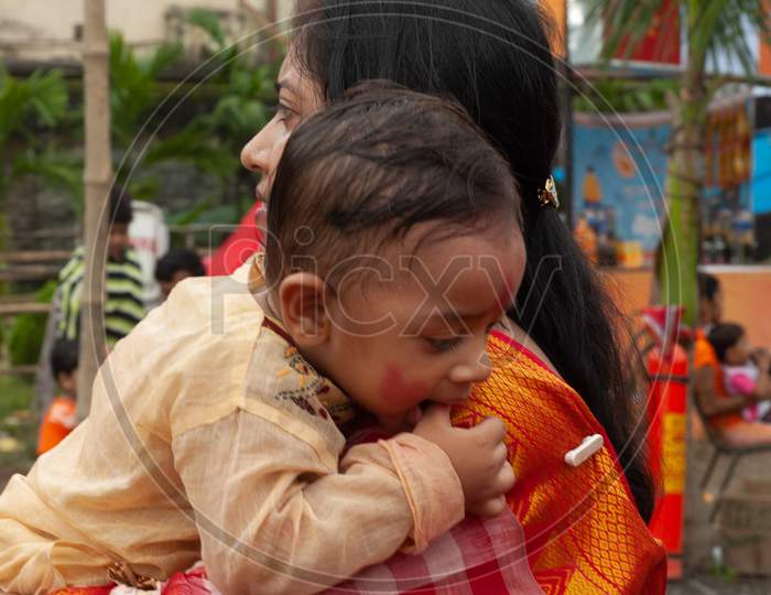 Indian Mother holding her baby boy