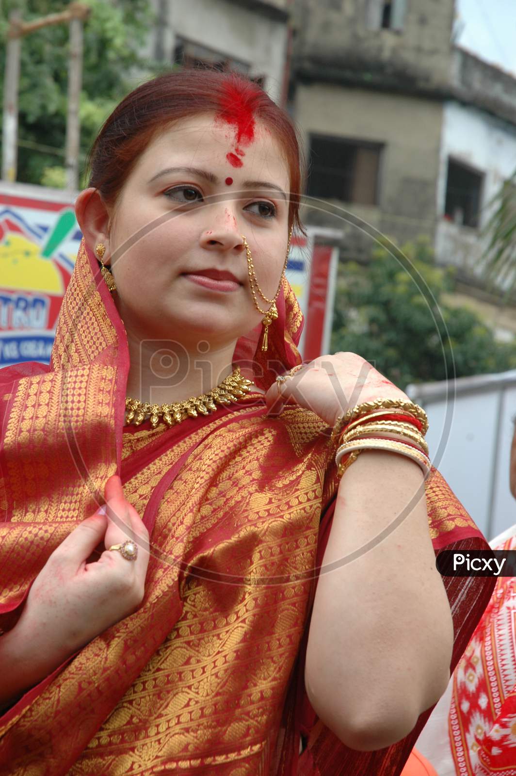 Indian Woman adjusting her saree