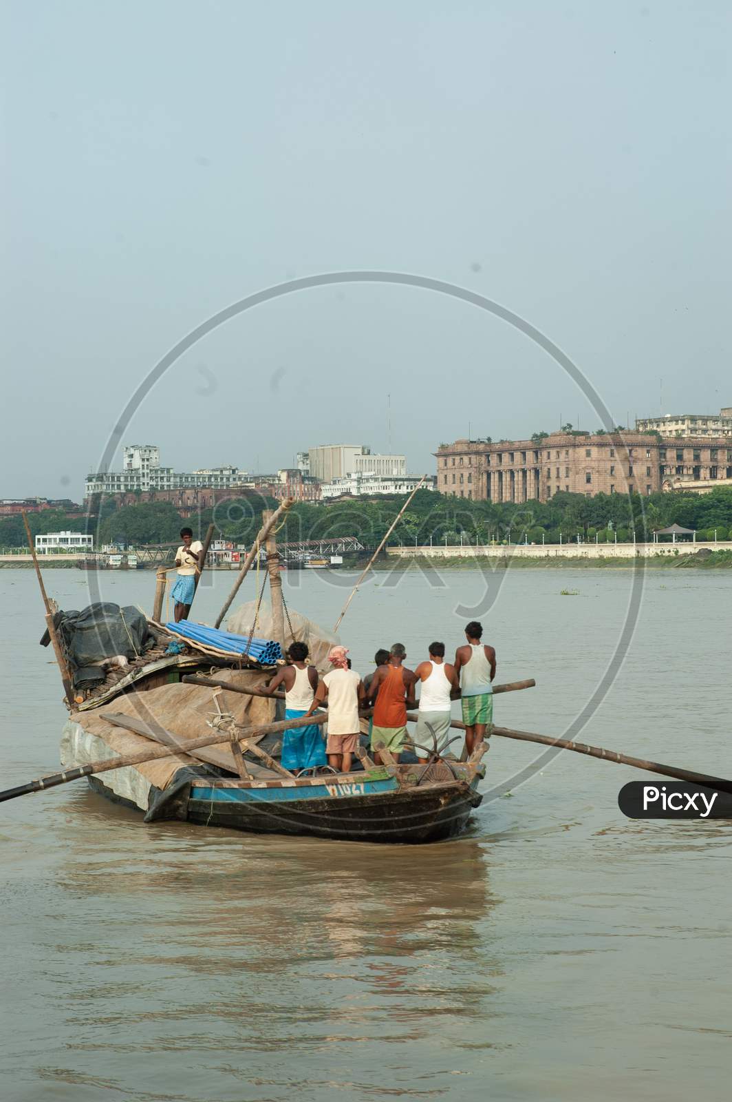 Indian Local fishermen rowing the boat