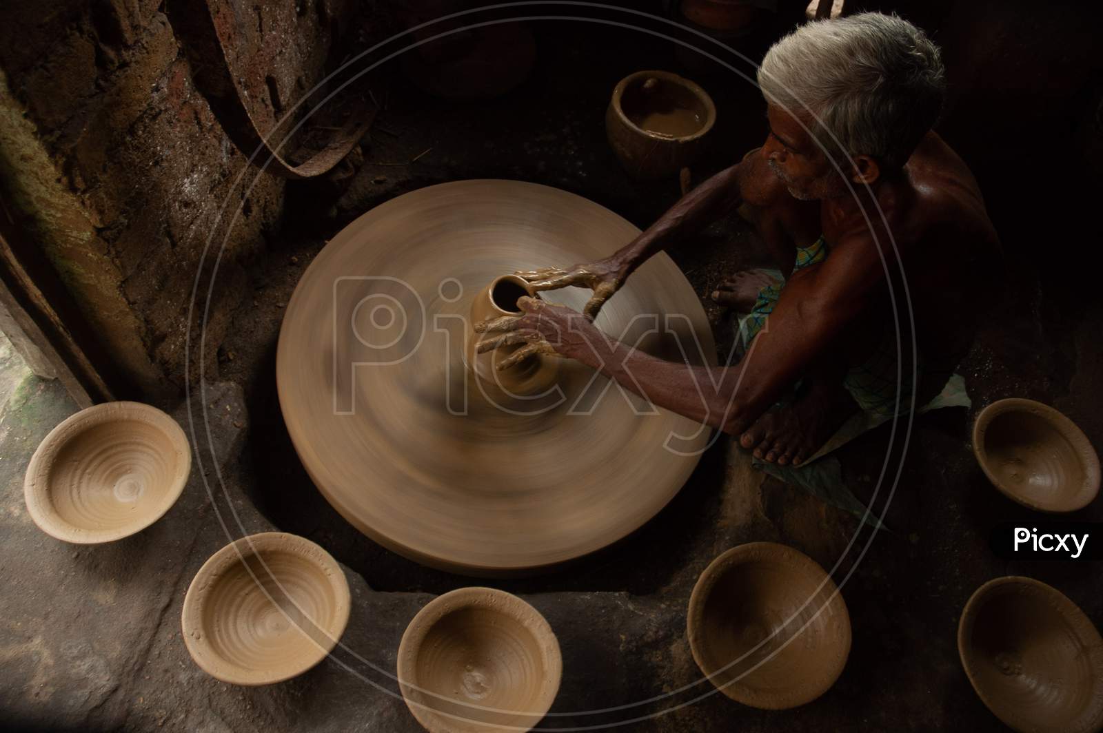A Potter Making Clay Pots In an Rural Village