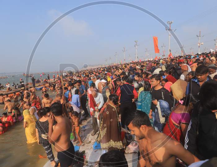 Indian Hindu Devotees  Taking Bath In Triveni Sangam River During  Magh Mela in Prayagraj 2020