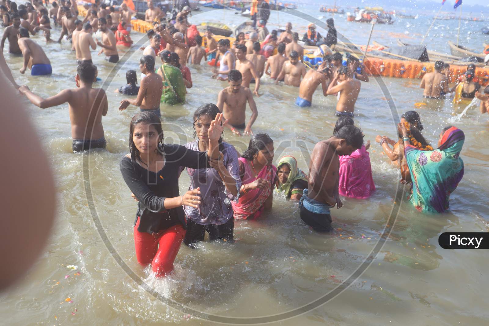 Image Of Indian Hindu Devotees Taking Bath In Triveni Sangam River