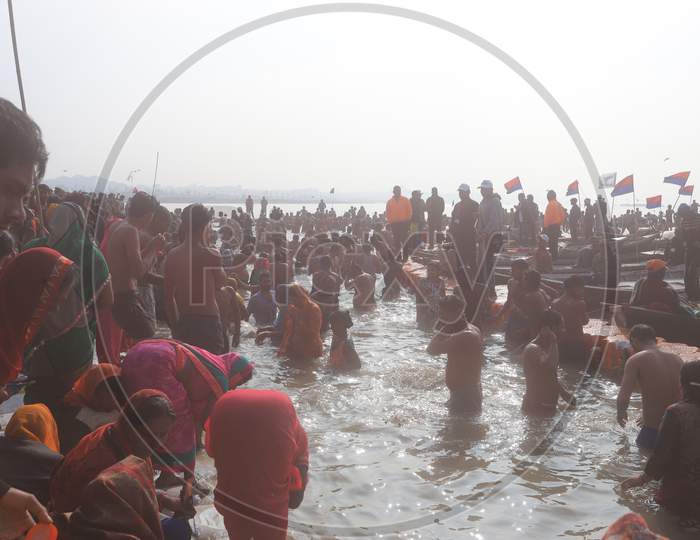 Image Of Indian Hindu Devotees Taking Bath In Triveni Sangam River During Magh Mela In Prayagraj