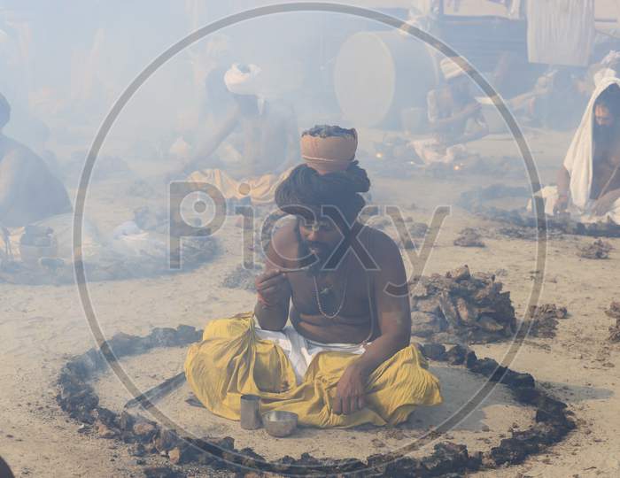 Indian Naga Sadhu or Aghora Performing Pooja At Prayagraj During  Magh Mela 2020