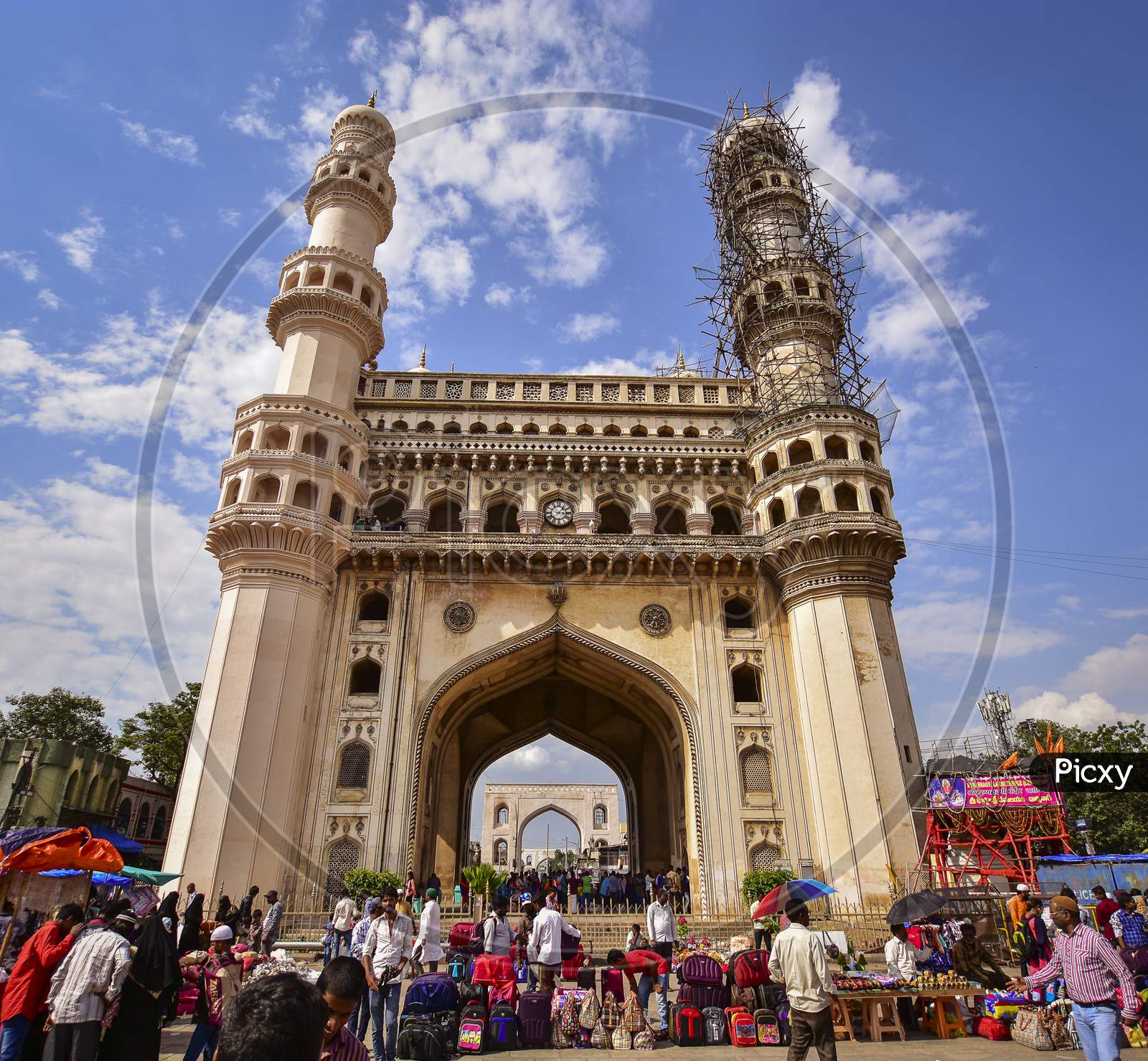 Charminar With Blue Sky And White Clouds As Background