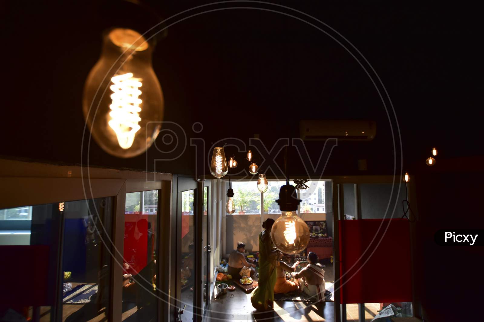 Electric filament Bulb  In a Cafe Interior