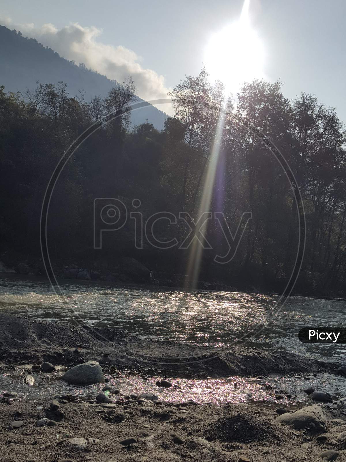 Sun rays over a River in Manali