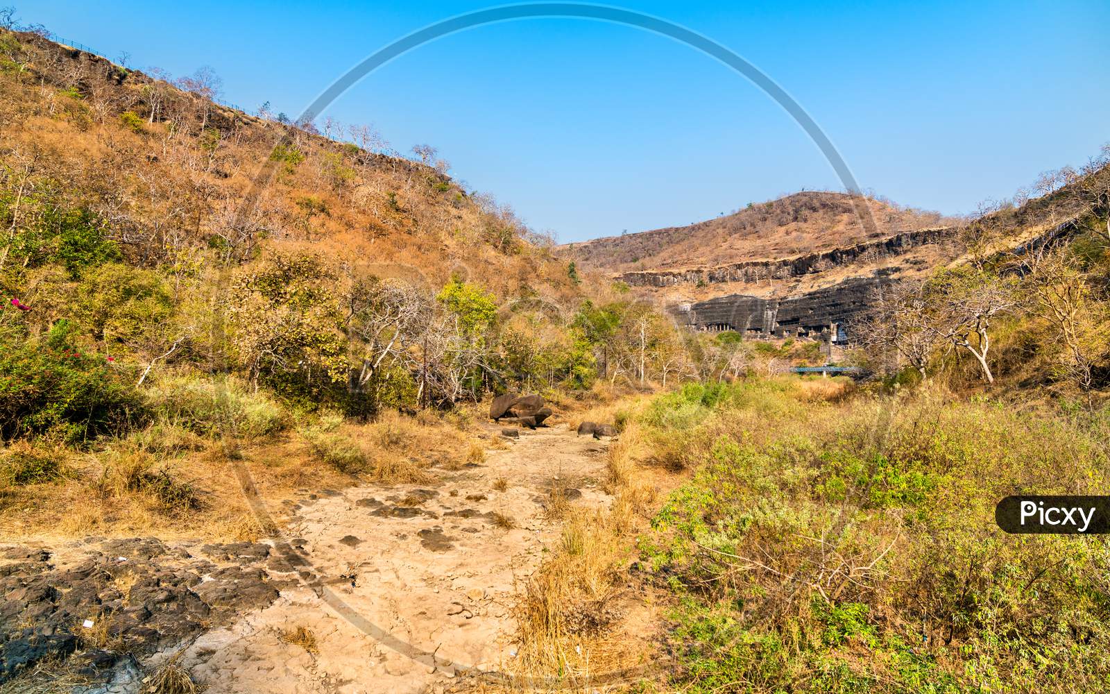 The Waghur River At The Ajanta Caves In A Dry Season. Maharashtra, India