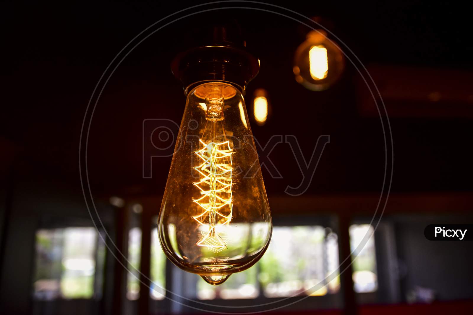 Electric filament Bulb  In a Cafe Interior
