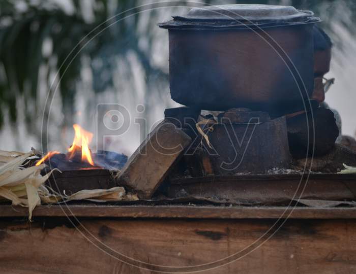 Corn Cooking in a vessel At a Road Side Stall