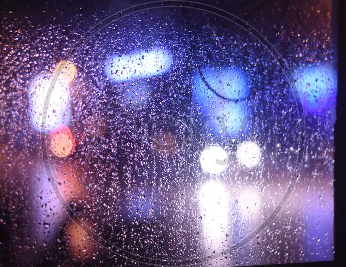 Rain water Droplets On a Glass Shield
