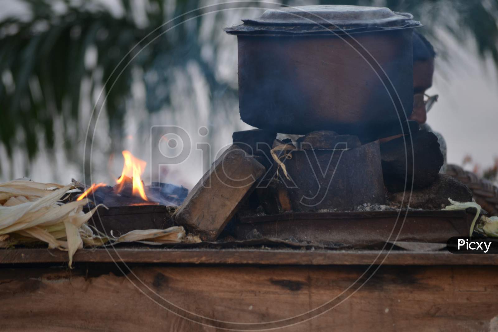 Corn Cooking in a vessel At a Road Side Stall
