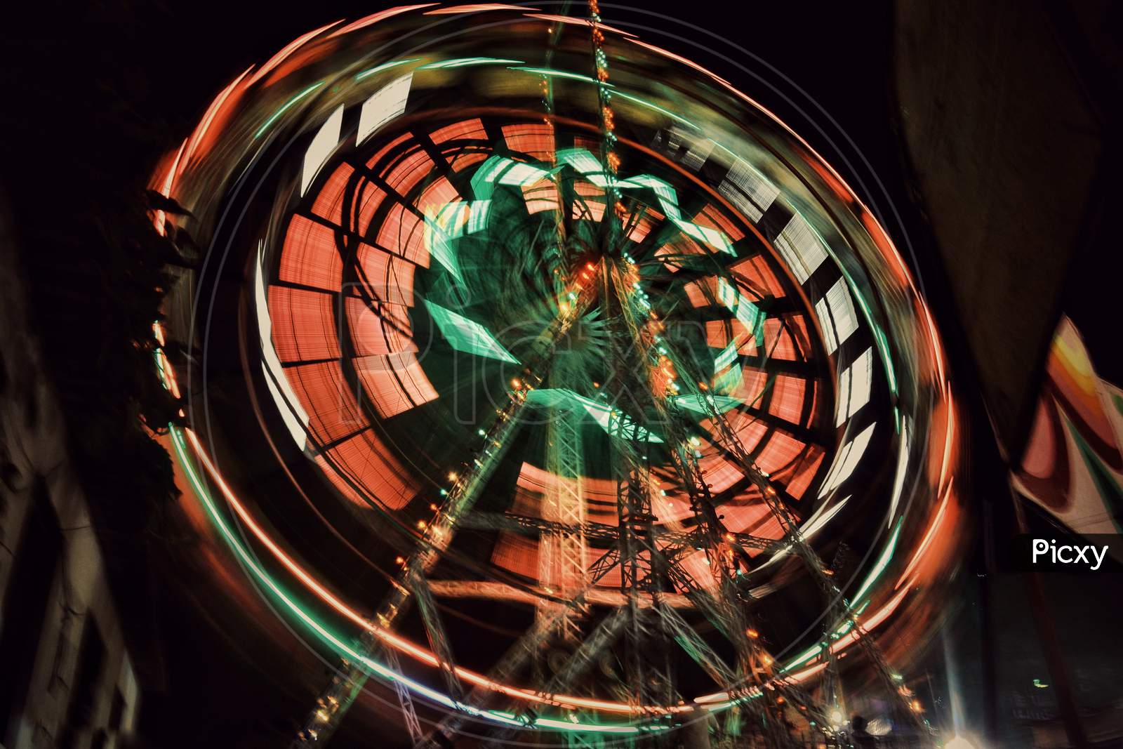 Long Exposure Of an Giant Wheel With Neon Lights   In a Fair