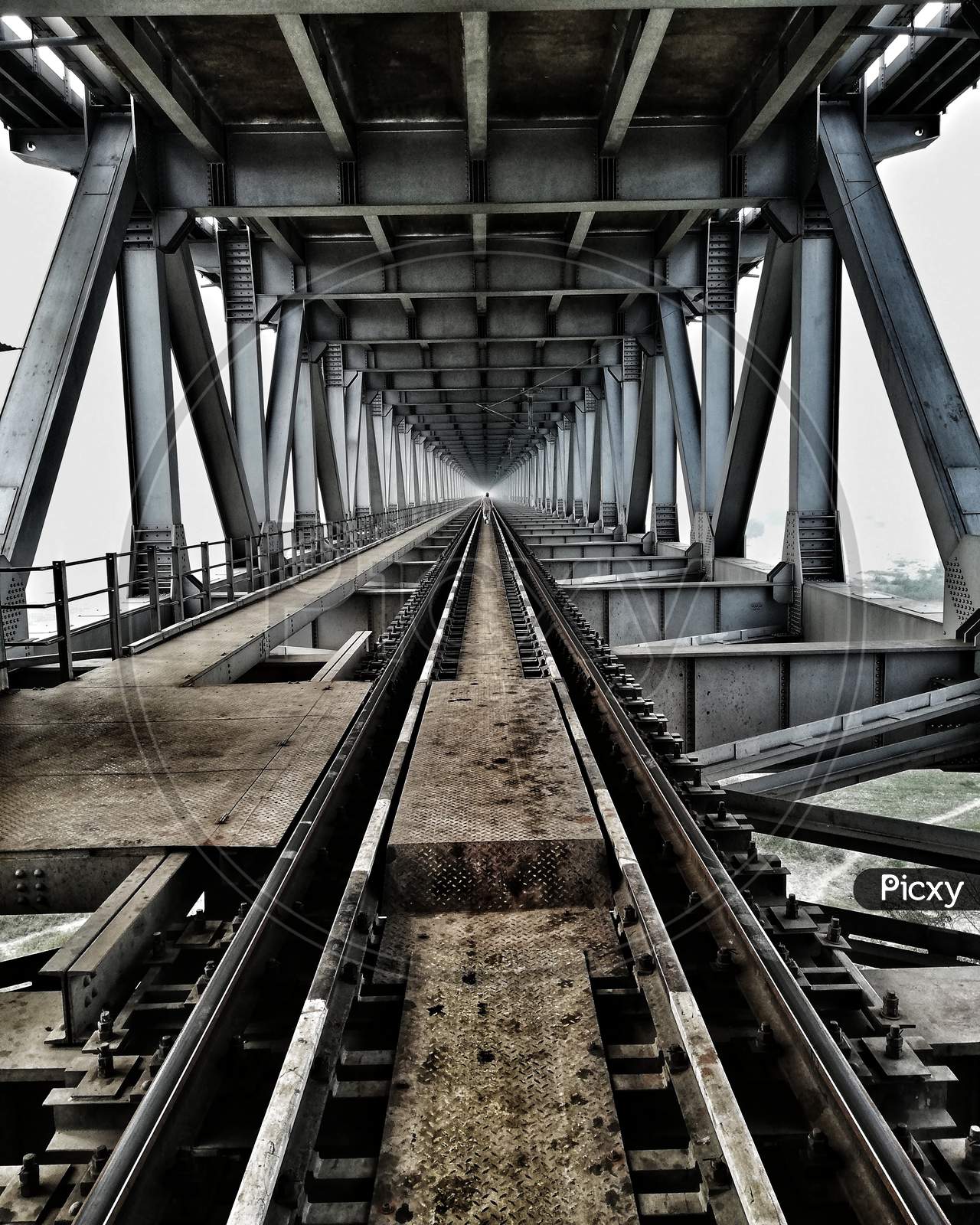 Iron Arch Bridge With Railway Track