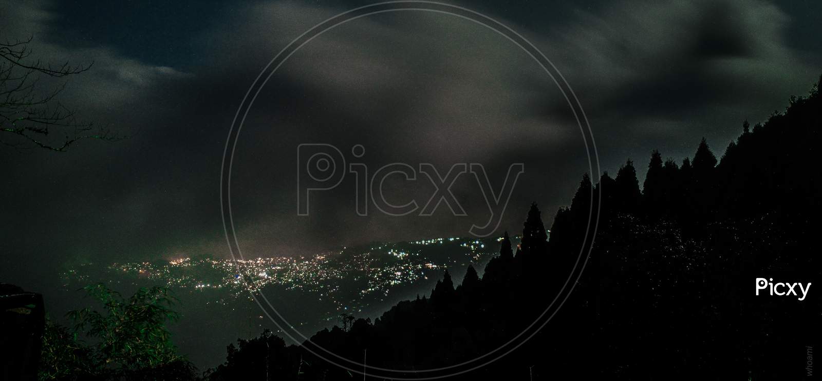 City Scape View With Night City Lights From a Hill