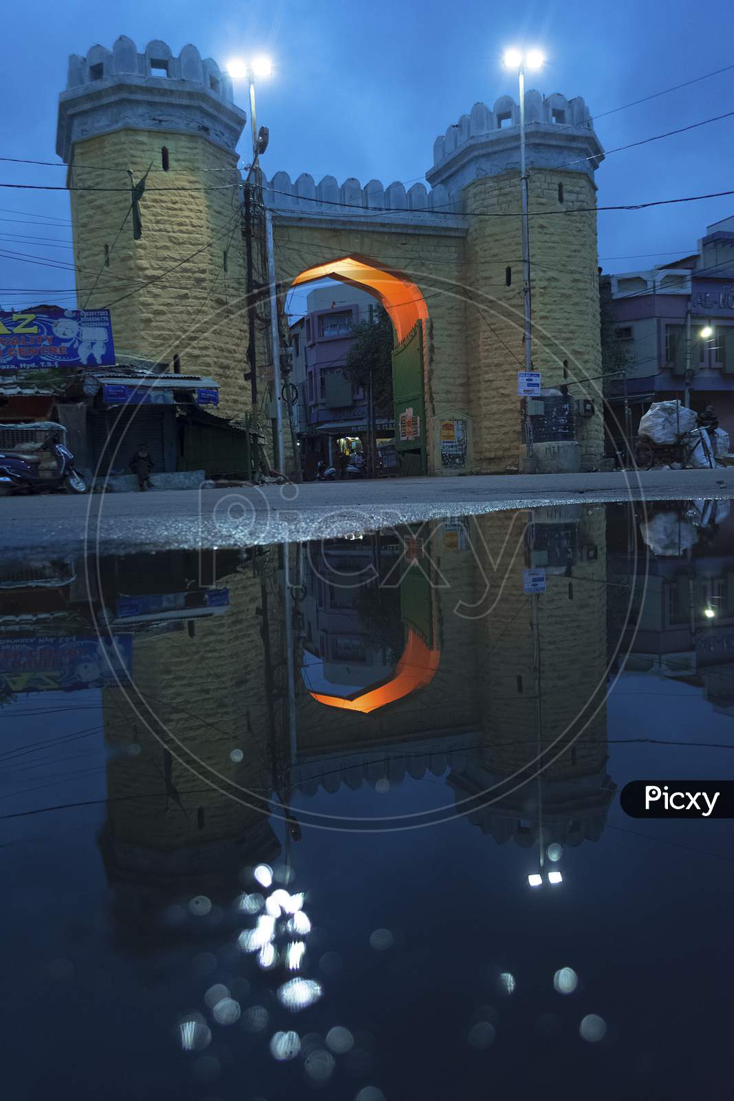 Reflection of an Arch On Water Surface