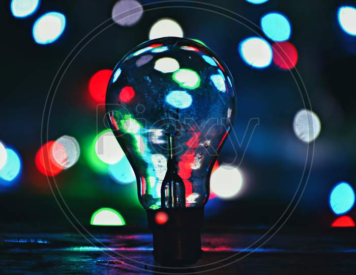 Electric Filament Bulb Over Led Bokeh Background