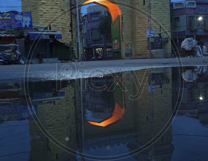 Reflection of an Arch On Water Surface