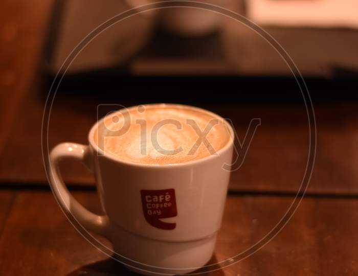 Cafe Coffee Day Coffee Cup on Table