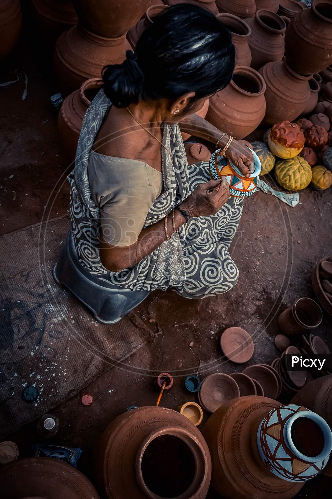 Potter Woman Painting Pots