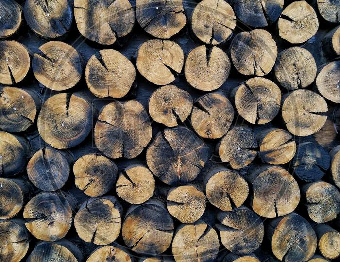 Wood logs arranged randomly.