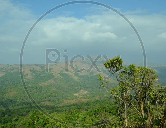 Landscape Of Green Hill With Blue Sky