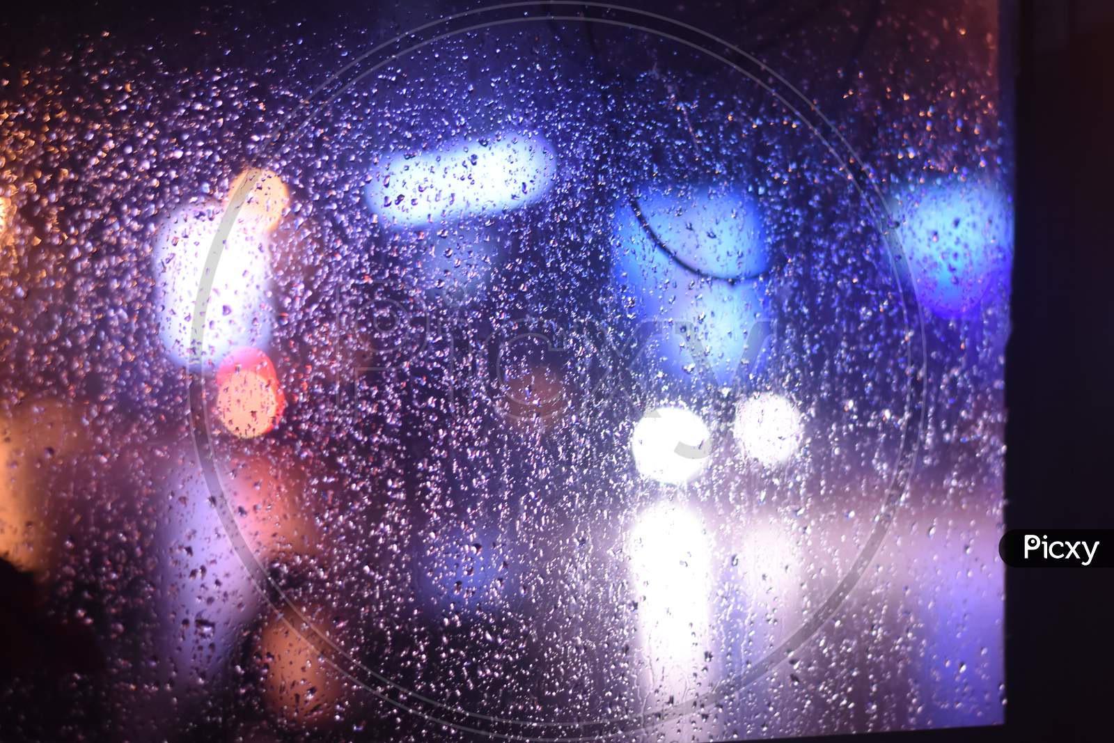 Rain water Droplets On a Glass Shield