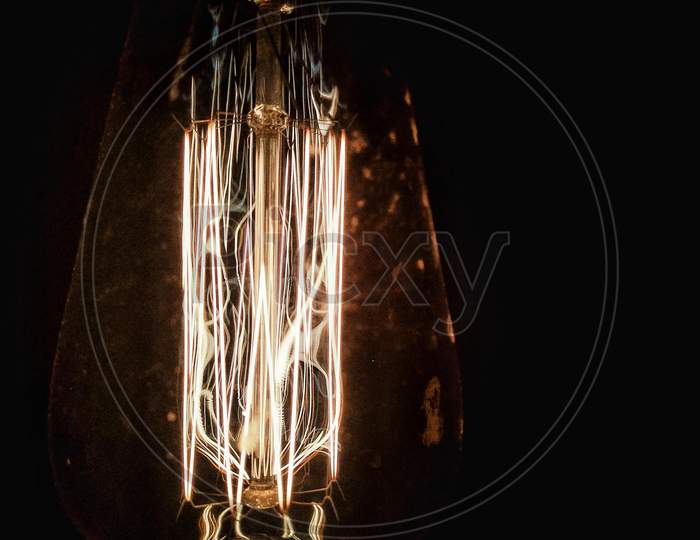 Electric Filament Bub Over Dark Background