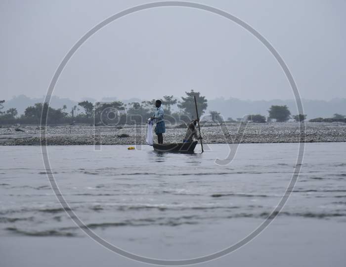 . Fishermen Lay Their Fishing Net In The Manas River In Baksa District Of Assam