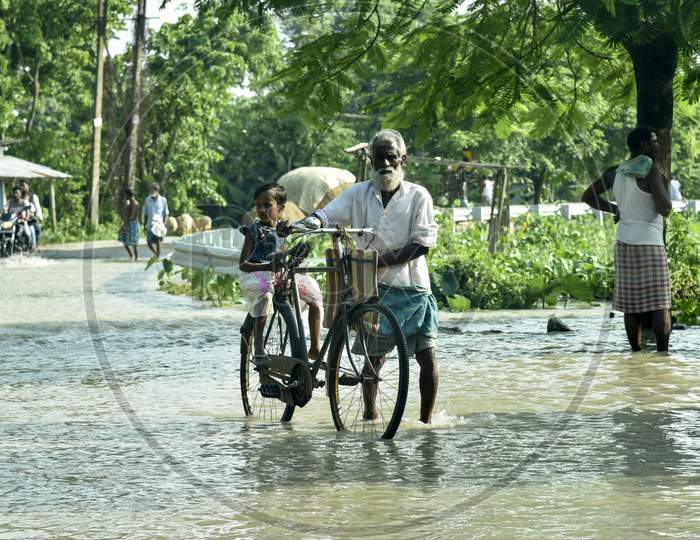 Assam People In Flood Filled Roads And Villages During Seasonal Floods in Guwahati Region