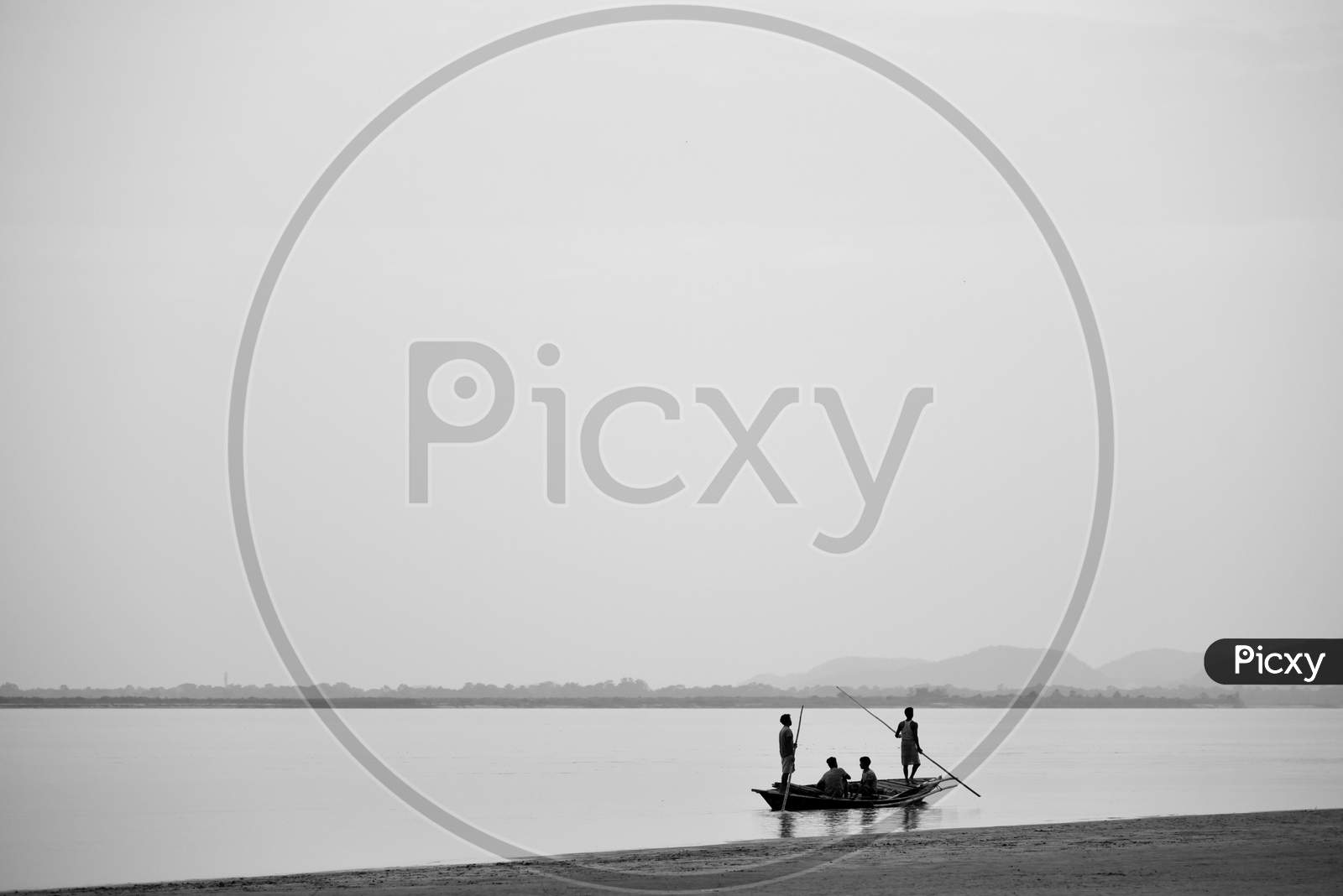 Silhouette Of Fisherman on Bramhaputra River Bank in Guwahati