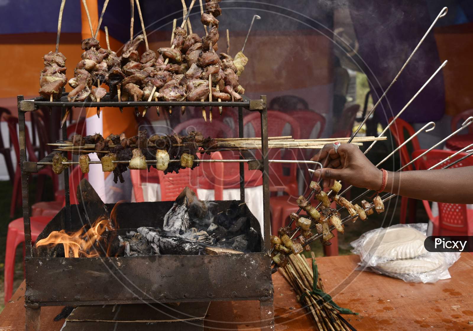 Assamese Street Food Pork Belly Being Barbecued on Fire In  Food Stall In Guwahati , Assam