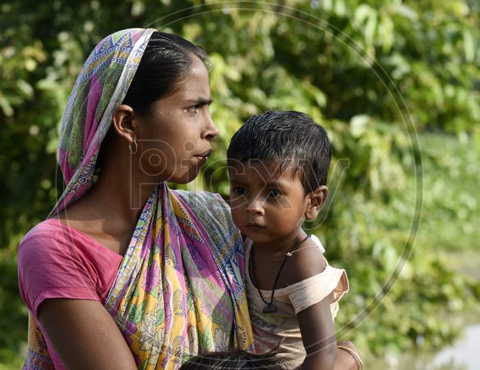 A Mother With Her Child In Assam Villages