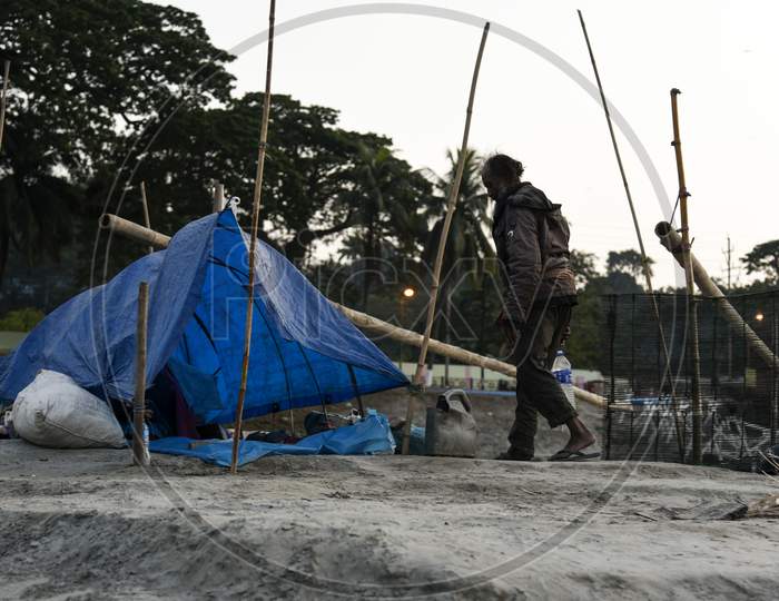 A Fisherman In His Makeshift Home In The Banks Of The Brahmaputra River, In Guwahati,