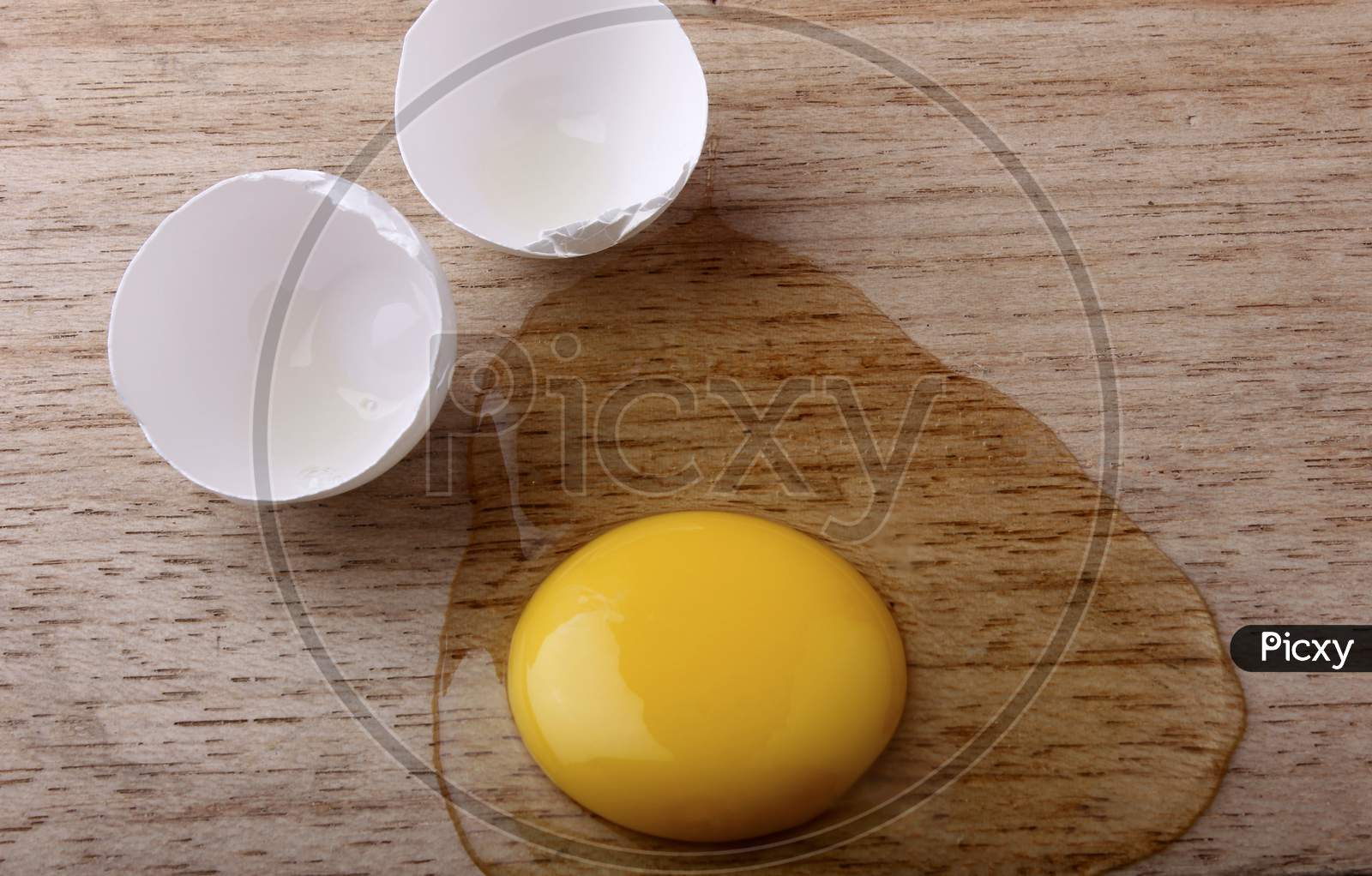 Egg Break On Wooden Table