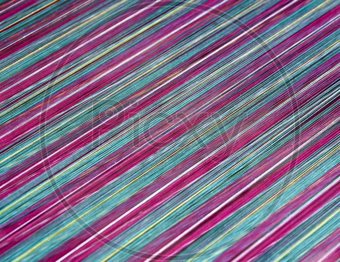 Pattern Of Colourful Lines Closeup Forming a Background