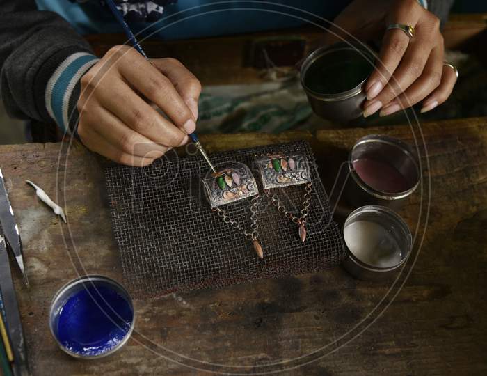 Worker Making Silver Jewellery In A Traditional Method In A Assamese Jewellery Manufacturing Unit In Nagaon, Assam