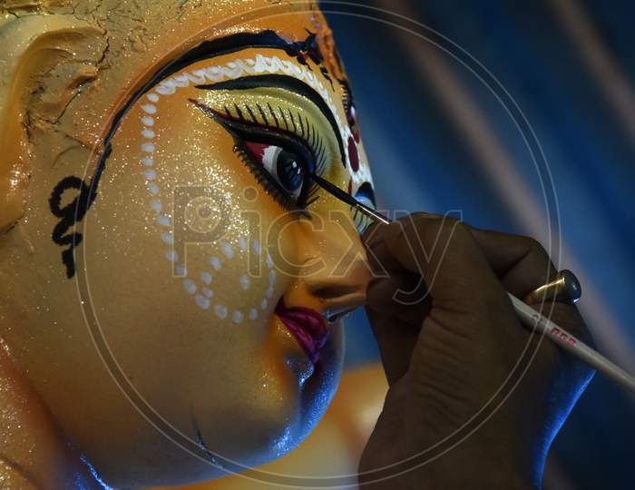 Artist Gives The Final Touches To An Idol Of The Goddess Durga Ahead Of Durga Puja Festival, In Guwahati, Assam, India