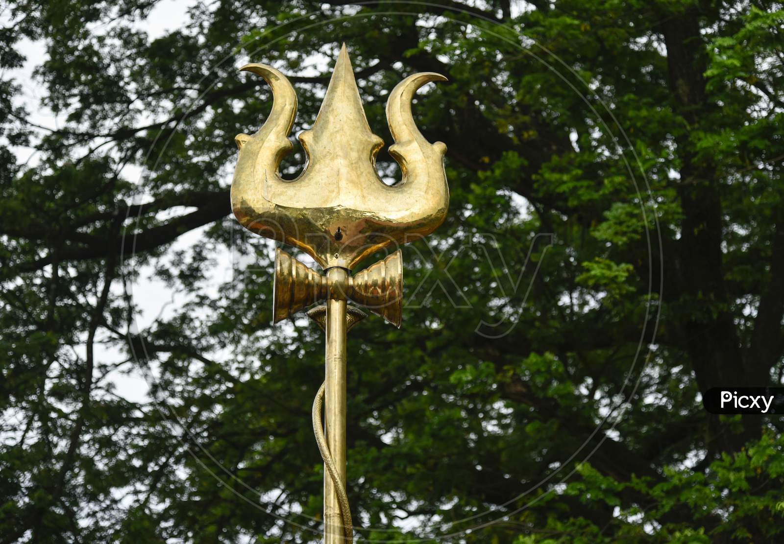 Lord Shiva Trishul Canopy With Tree in Background