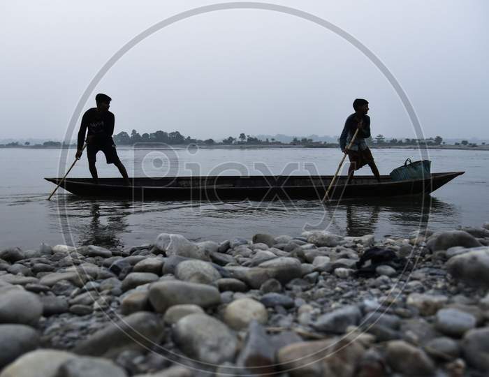 . Fishermen Paddle In The Manas River In Baksa District Of Assam, Some 140 Km From Guwahati