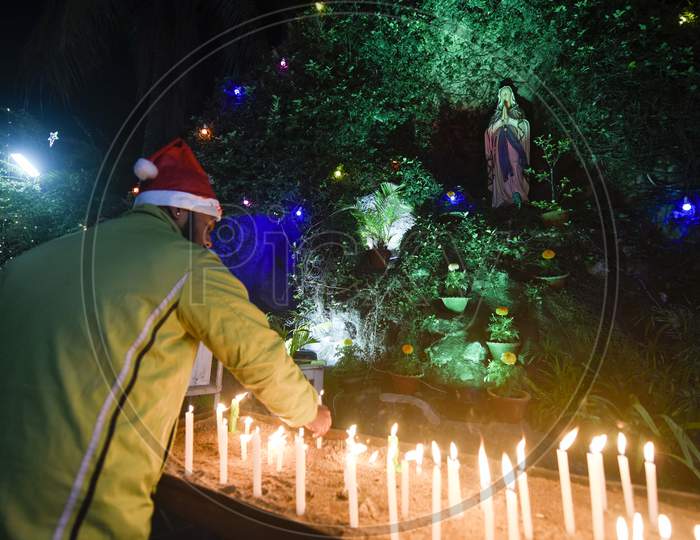 Devotees Light Candles At Saints Johns Church, On The Eve Of Christmas In Guwahati