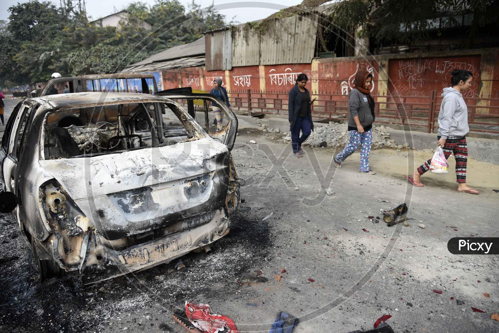 A Charred Vehicle Which Was Reportedly Set On Fire By The Protestors During A Demonstration Against The Citizenship Amendment Bill, In Guwahati