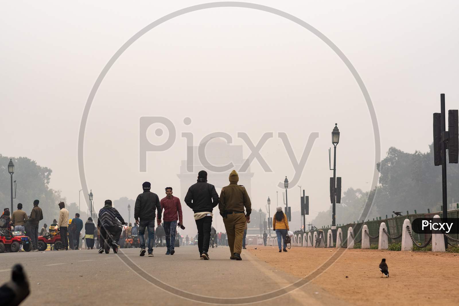 People walking in the foggy evening during winters in Delhi NCR
